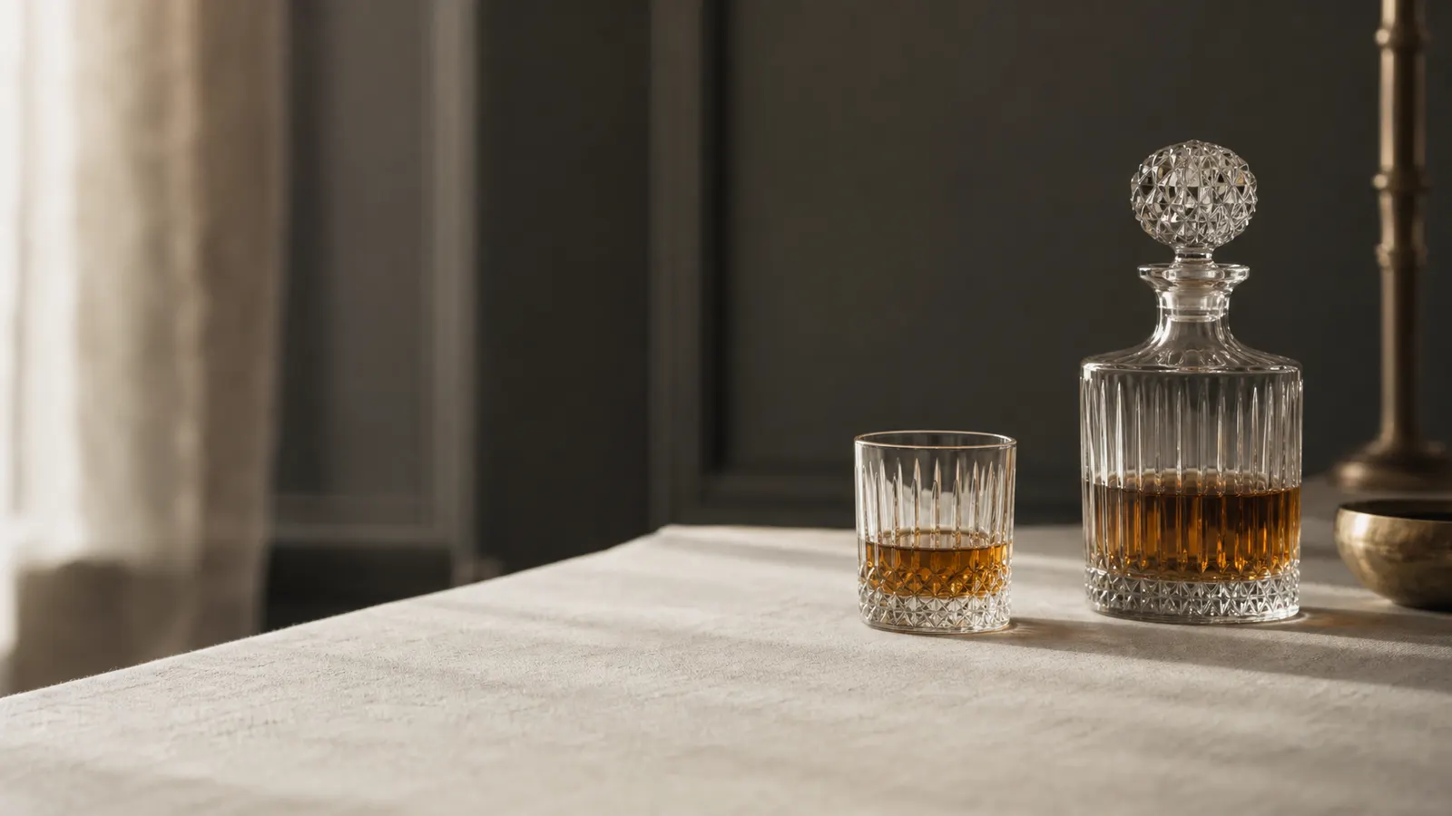 Decanter with half its contents poured into a glass